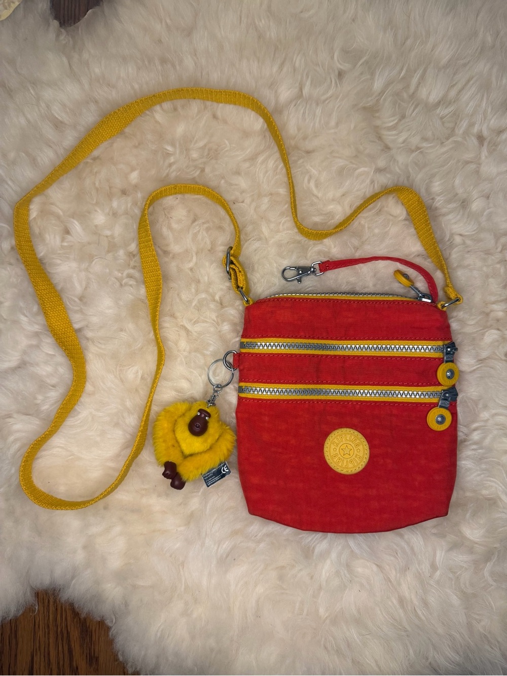 Kipling Red Crossbody Bag with Yellow Strap and Gorilla Charm